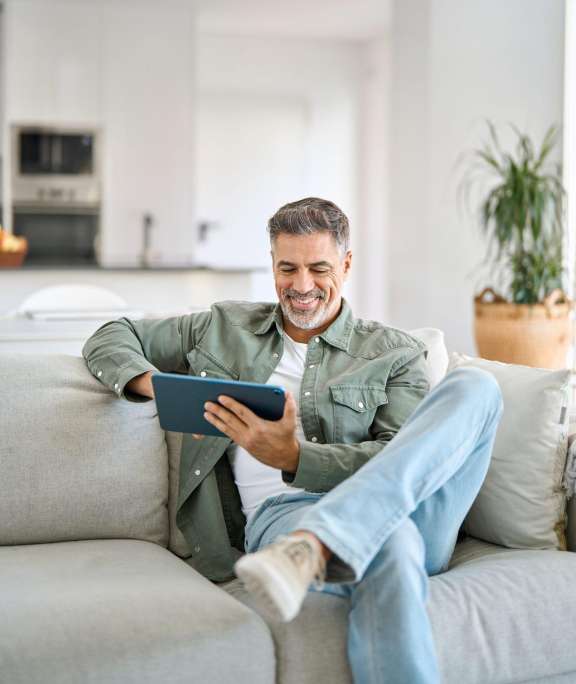 older man on ipad