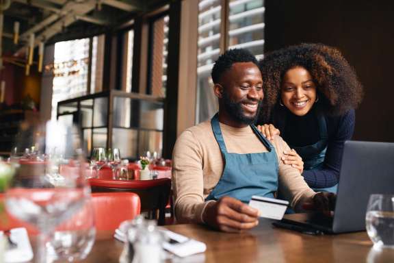 Business Owners Working on Laptop