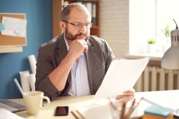 Mature Adult man working in the office