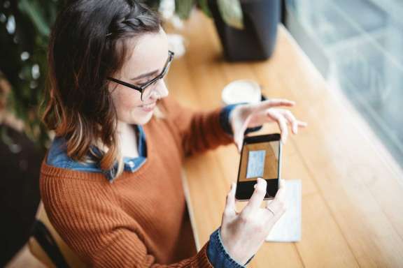 Girl taking photo with phone