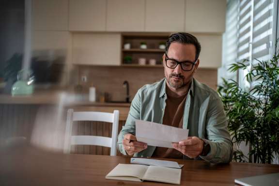 Man looking at mail