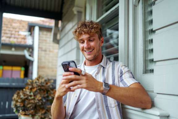 Man on phone smiling