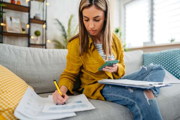 Woman writing on papers