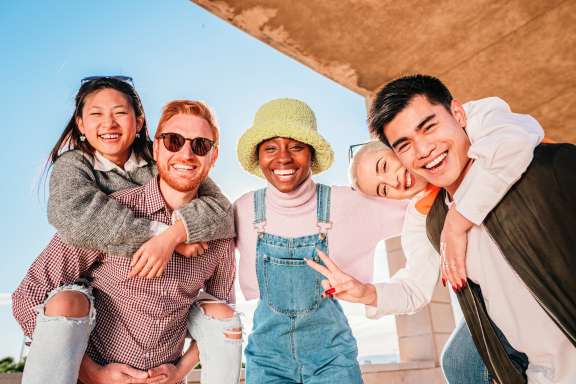 Group of multiracial happy young friends having fun together adn smiling. high quality photo