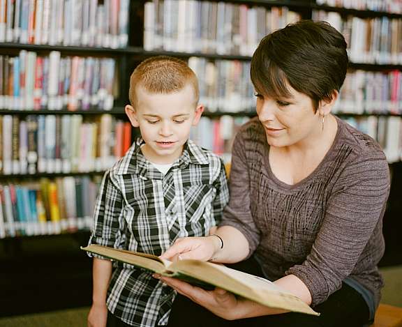 Woman teaching kid