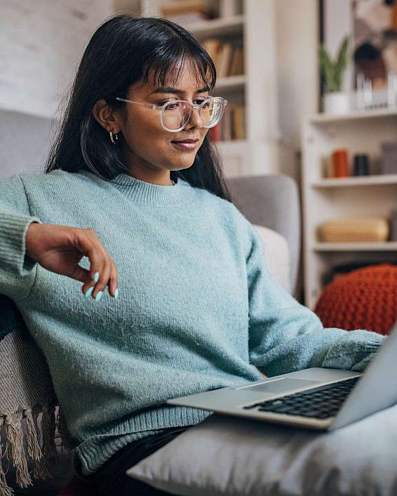 teen girl looking at laptop cropped