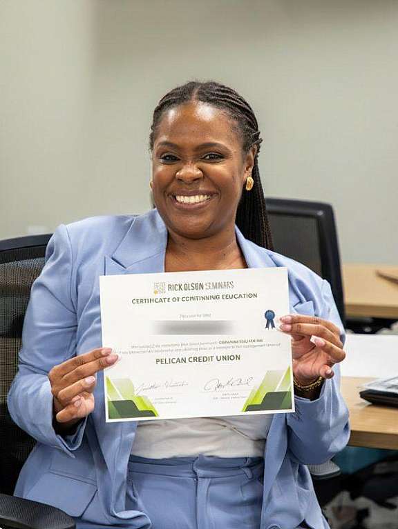 Pelican employee with certificate