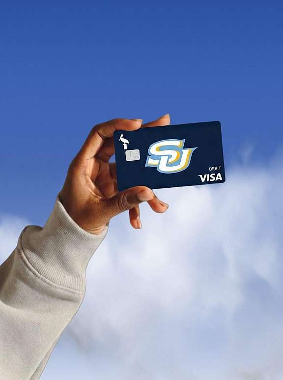 Person holding credit card with custom design