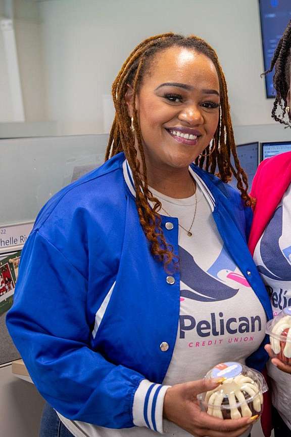 Pelican employees with cakes