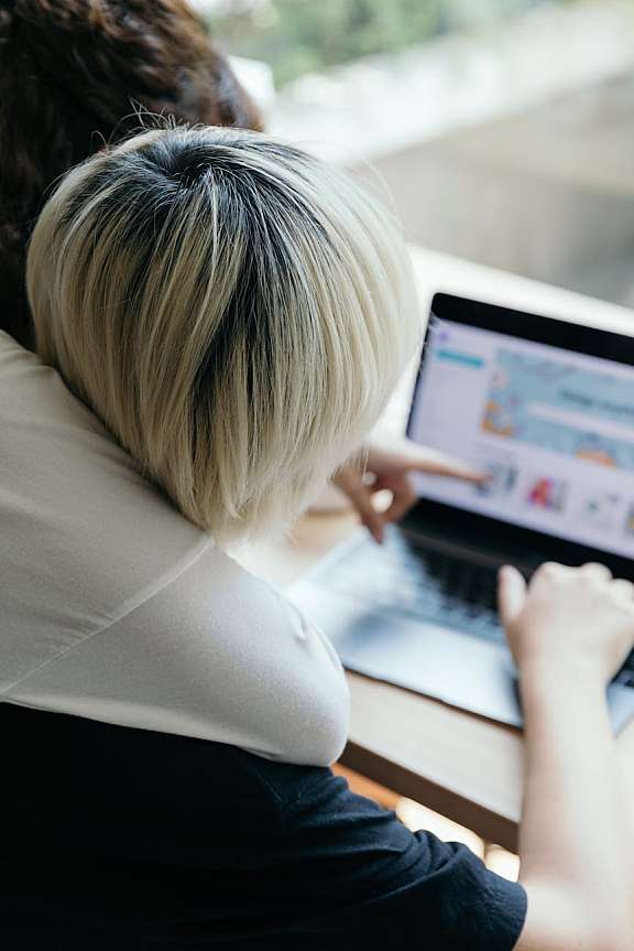 Girls looking at laptop